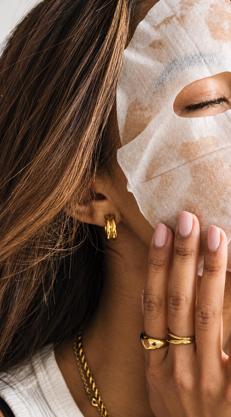 Creator applying a sheet mask